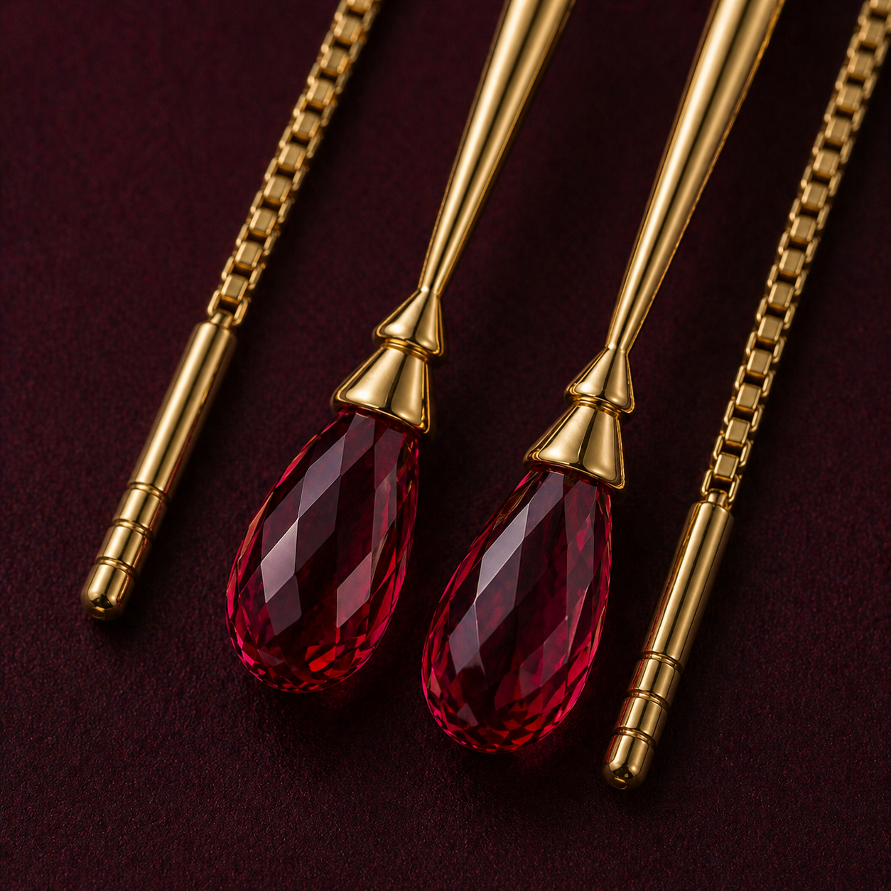 Detail close-up of dimensional sword charm and faceted briolette ruby in deep crimson on 18k gold threader.
