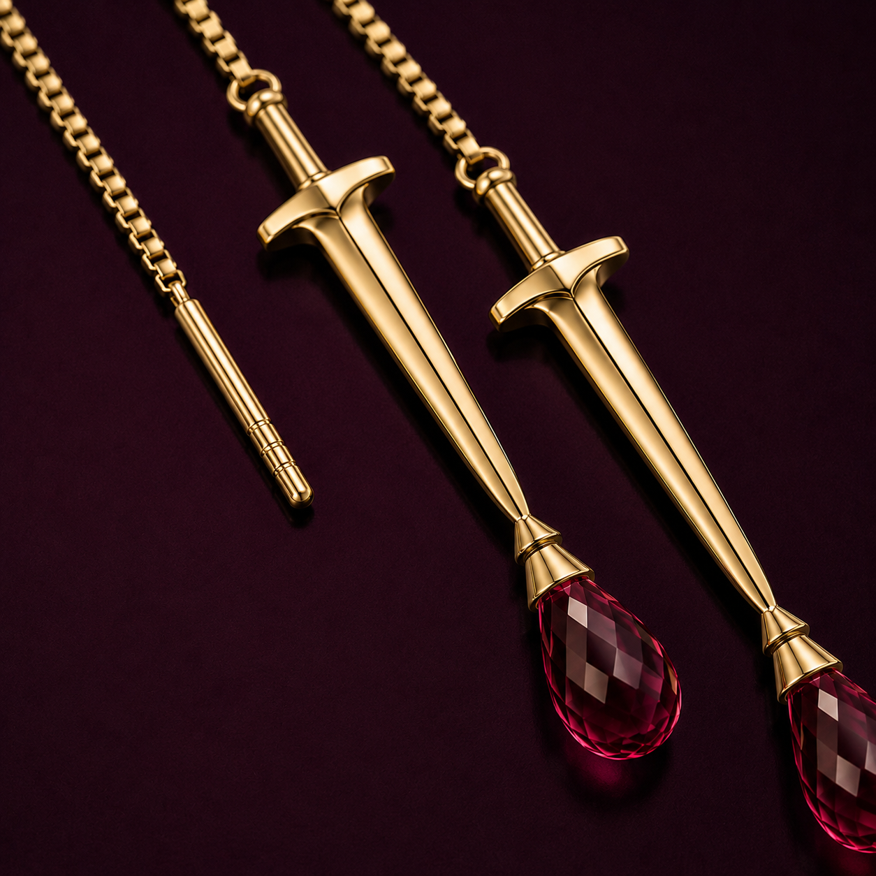 Gold sword-shaped pendant with natural ruby | the sovereign sword threader earring by eliza